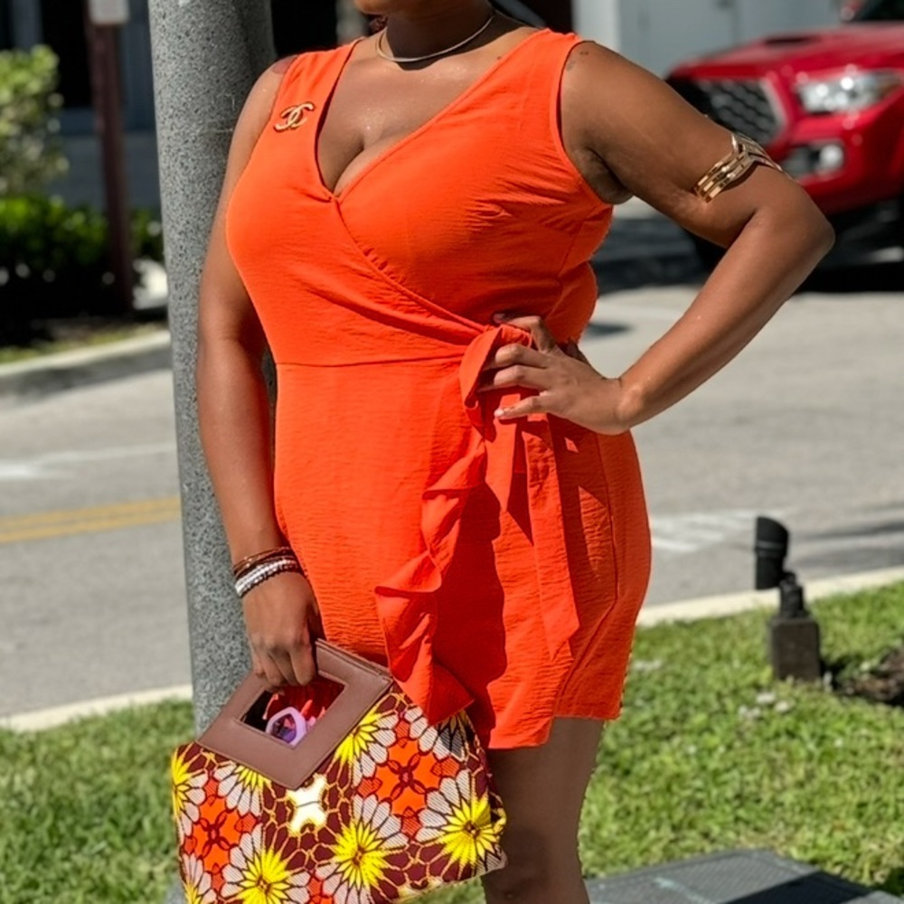 Emma & Michelle (L) Sleeveless Orange Romper w/ Asymmetrical Wrap Skort Design